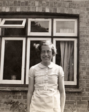 Evacuee standing outside house, Chichester, c1940