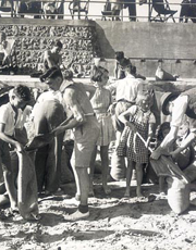 Children fill sandbags on the beach in preparation for war, 1939