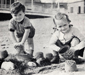 Children make sandcastles on Worthing beach c1951