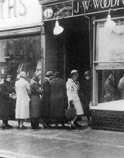 Women queue outside J.W. Woodford for fish during rationing, Bognor Regis