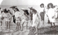 Girls paddling on Worthing beach c1900
